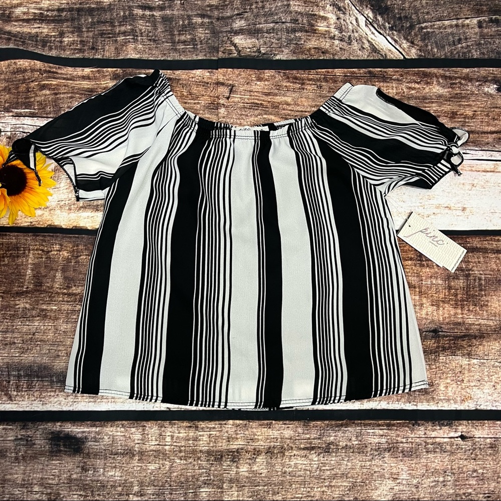 Girls stripe top by Pinc is NWT. Size small